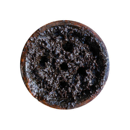 clay bowl with tobacco for smoking hookah top view on a white isolated backgroundの写真素材