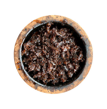 clay bowl with tobacco for smoking hookah top view on a white isolated backgroundの写真素材