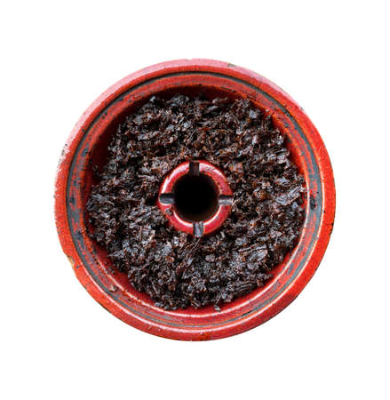 clay bowl with tobacco for smoking hookah top view on a white isolated backgroundの写真素材