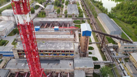Air pollution by smoke coming out of factory chimneys. Birds-eye view of the industrial zone in the Leningrad regionの写真素材