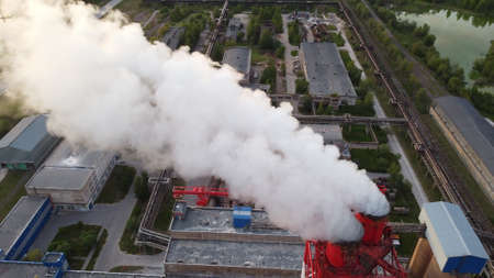 Air pollution by smoke coming out of factory chimneys. Birds-eye view of the industrial zone in the Leningrad regionの写真素材