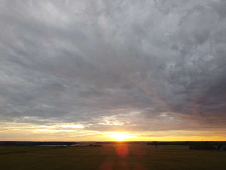 sunset sky with clouds backgroundの写真素材