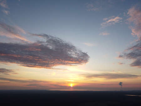sunset sky with clouds backgroundの写真素材