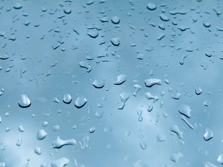 Water droplets on the glass with a background