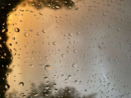 Water droplets on the glass with a background
