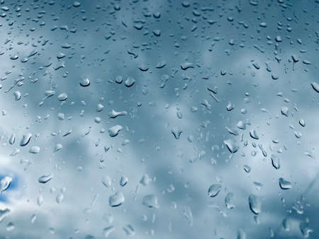 Water droplets on the glass with a background