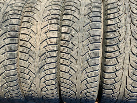 old winter car stud tires close upの写真素材