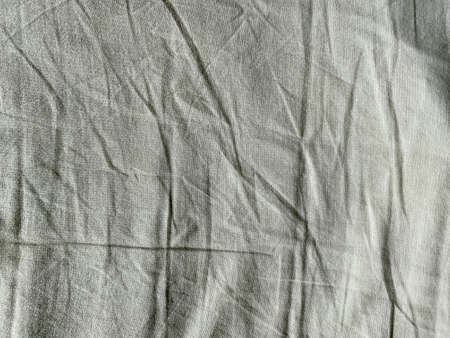 Background Of Crumpled Dense Fabric