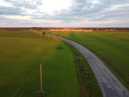 old car road at sunset in summer aerial photographyの写真素材