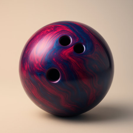 Glossy bowling ball with red and blue swirl pattern. Studio lighting and soft background. Sport equipment detail.の素材