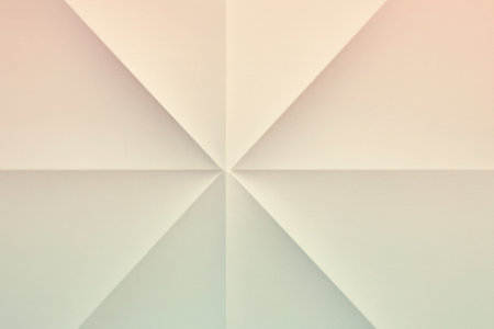 Symmetric folded paper surface with clean triangular shapes meeting in the center. Soft pastel light creates a calm modern background.の素材