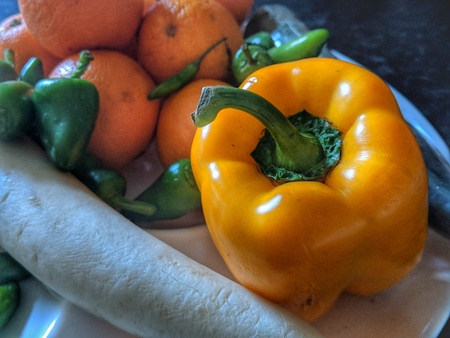 fruits vegetables on a plate in colourful photo