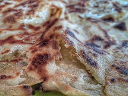 asian buttery chapati called paratha with beautiful texture