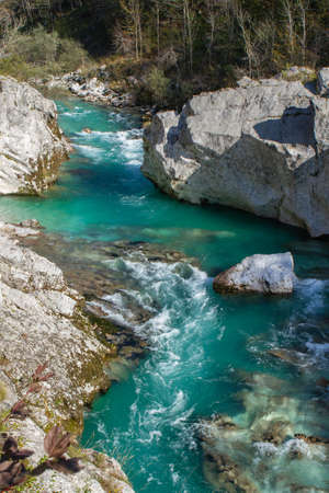Kobarid, Slovenia - October 28, 2014: The Soca river flows through western Slovenia and its source...