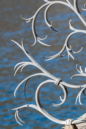 Close up of metal fences along Lake Lugano in the Swiss canton of Ticino