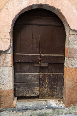 Old semicircular door of antique house in Morcote, Canton of Ticino, Switzerlandの写真素材