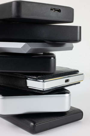 A bunch of isolated storage hard drives on the white background