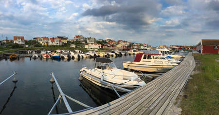 Evening panoramic view of the picturesque Swedish harbor of boats and yachtsのeditorial素材