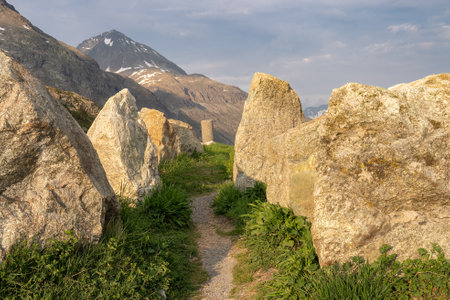 A way past the group of big stones at the top of the mountain pass Julierpass in Switzerlandの写真素材