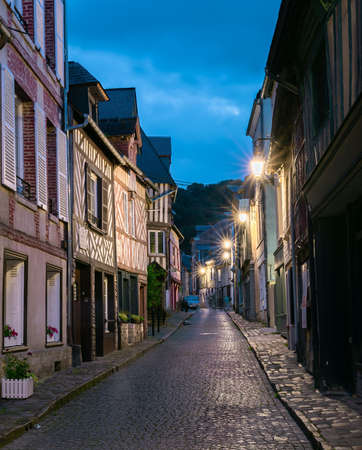 Honfleur, France - August, 4, 2021: Picturesque street of old town Honfleur, a french commune in the Calvados department and famous tourist resort in Normandy. Especially known for its old port.のeditorial素材