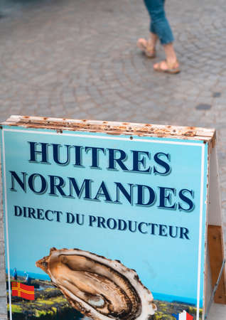 Honfleur, France - August 4, 2021: French sign for road sale of oysters of Normandy directly from producersのeditorial素材