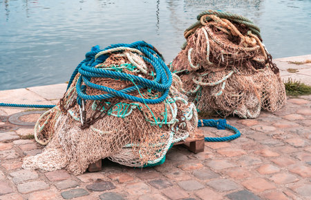 Fishing nets on the shore of Honfleur in French Normandy, prepared for further useの写真素材