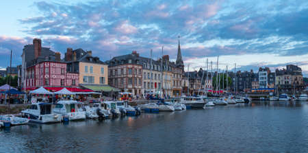 Honfleur, France - July 28, 2021: Honfleur is a french commune in the Calvados department and famous tourist resort in Normandy. Especially known for its old port.のeditorial素材