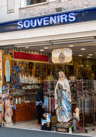 Lourdes, France - August 28, 2021: A souvenirs shop in Lourdes, selling devotional objects to pilgrims.のeditorial素材
