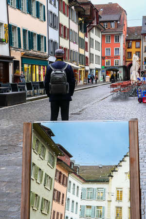 Aarau, Switzerland - November 3, 2021: A man visits the old town of Aarau, the capital of the...