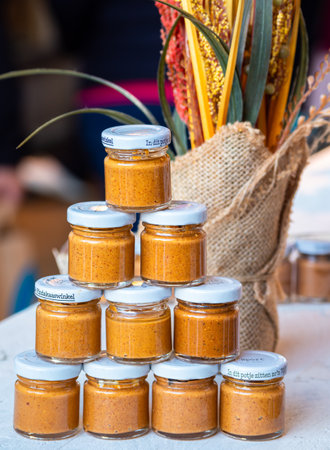 Rotterdam, Netherlands - April 28, 2022: Peanut butter glasses - a local product on sale at a market...