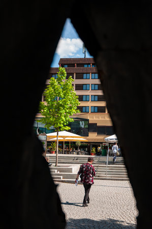 Feldkirch, Austria - May 20, 2022: View through the opening to the modern building downtown of Feldkirch, Austriaのeditorial素材