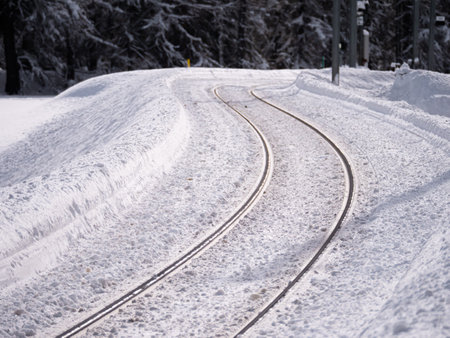 Snow covered train track in Engadin, Grisons, Switzerlandの写真素材