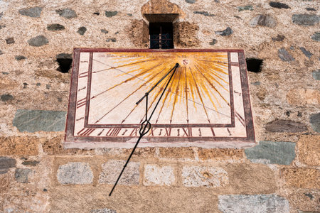 Medieval sundial on the wall in Mustair