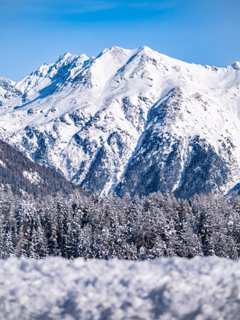 Winter landscape and snowy mountain Piz Esan in Engadine, Switzerland