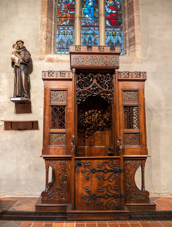 Colmar, France - December 13.2021: Old wooden confessional in the church in Colmarのeditorial素材