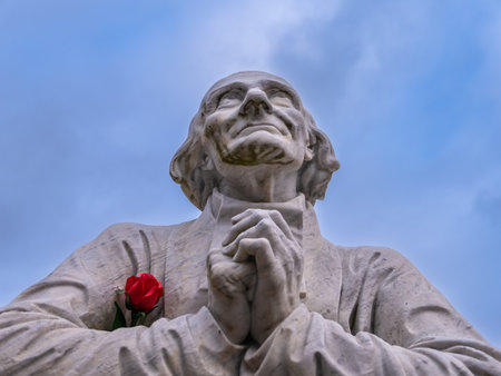 Lourdes, France - February 1, 2022: A statue of Jean-Marie Vianney , venerated as Saint John Vianney, a French Catholic priest and a patron saint of parish priests.のeditorial素材
