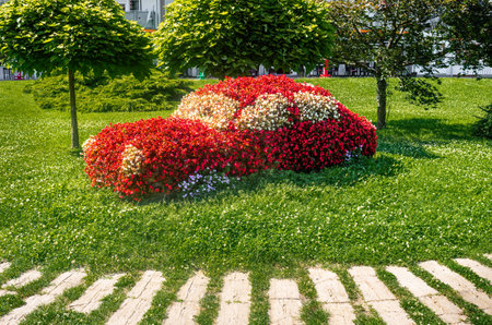 Outdoor flower car in Lenti, Hungary - a car sculpture made of red flowersの写真素材