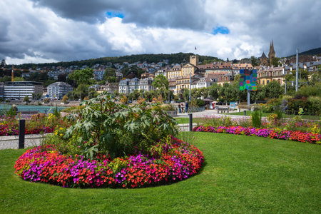 Neuchatel, Switzerland - August 7, 2023: Flowering city garden and cityscape of Neuchatelのeditorial素材