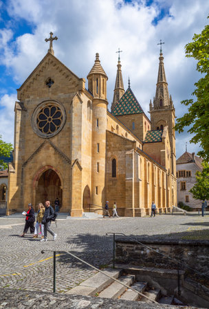 Neuchatel, Switzerland - August 7, 2023: The collegiate church in Neuchatel, built between 1185 and 1276, represents the Romanesque and Gothic styles.のeditorial素材
