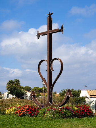 Saintes Maries de la Mer, France - October 2, 2023: The Camargue cross represents the three cardinal virtues : The cross for faith. The anchor for hope. The heart for charity.のeditorial素材