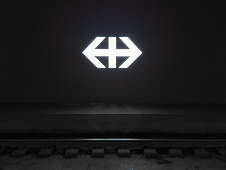 Zurich, Switzerland - December 1, 2023: The illuminated SBB Swiss Federal Railways rail network logo is on the wall at Zurich train station.のeditorial素材