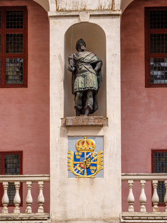Lacko, Sweden - May 29, 2023: Statue of a noble man and the coat of arms in the courtyard of the Lacko castle.のeditorial素材