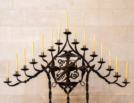 Barcelona, Spain - October 7, 2023: Candlestick with 15 candles in modernist Sagrada Familia basilica, considered the masterpiece of Catalan architect Antoni Gaudiのeditorial素材