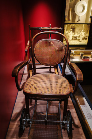 Beaune, France - August 16, 2023: Antique wooden hospital wheelchair in Beaune Hospital Museum, Burgundyのeditorial素材