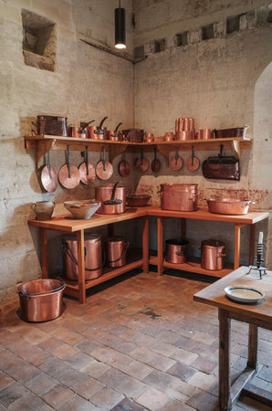 Chambord, France - August 8, 2023: Antique copper dishes in the kitchen of Chambord Castleのeditorial素材