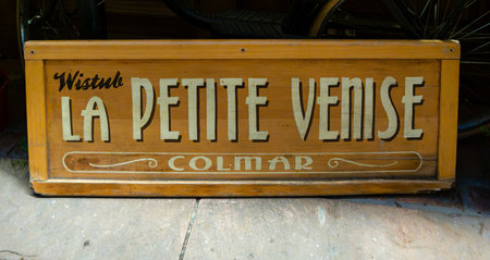 Colmar, France - December 27, 2023: Wooden sign in the old town of Colmar, La Petite Venise, which in translation means Little Veniceのeditorial素材