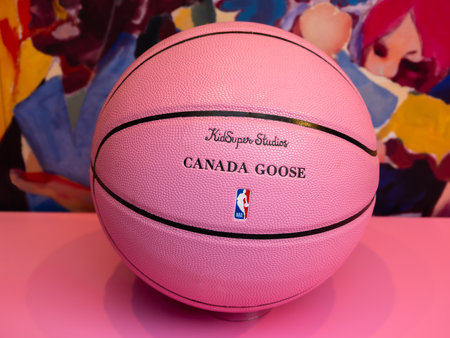 London, United Kingdom - February 26, 2024: Pink football with signs of Canada Goose winter clothing manufacturers, Kid Super studios streetwear clothing and NBA - National Basketball Associationのeditorial素材