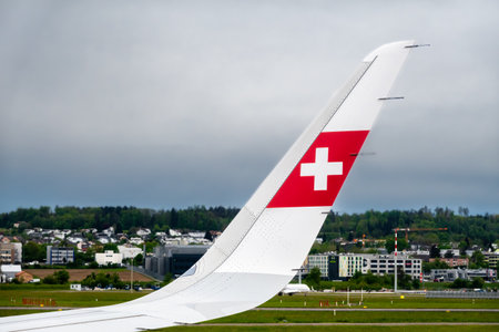 Zurich, Switzerland - April 28, 2024: Airplane with the symbol of the airline Swiss on the wingのeditorial素材