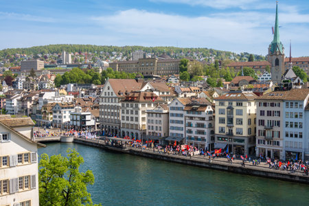 Zurich, Switzerland - May 1, 2024: May Day protests and demonstrations - a procession along the Limmat river through the streets of the old town of Zurichのeditorial素材