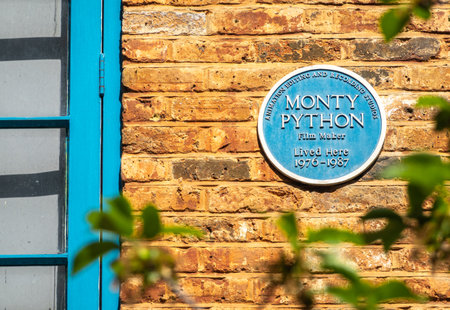 London, United Kingdom - April 29, 2024: Orange facade with blue windows at Neal's Yard, a colorful and vibrant alley in the Covent Garden area of London. House of Monty Pythonのeditorial素材